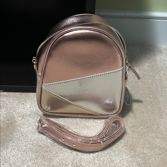 Bath & Body Works Handbags - NWT Bath & Body Works Rose Gold and Silver Mini Backpack Crossbody